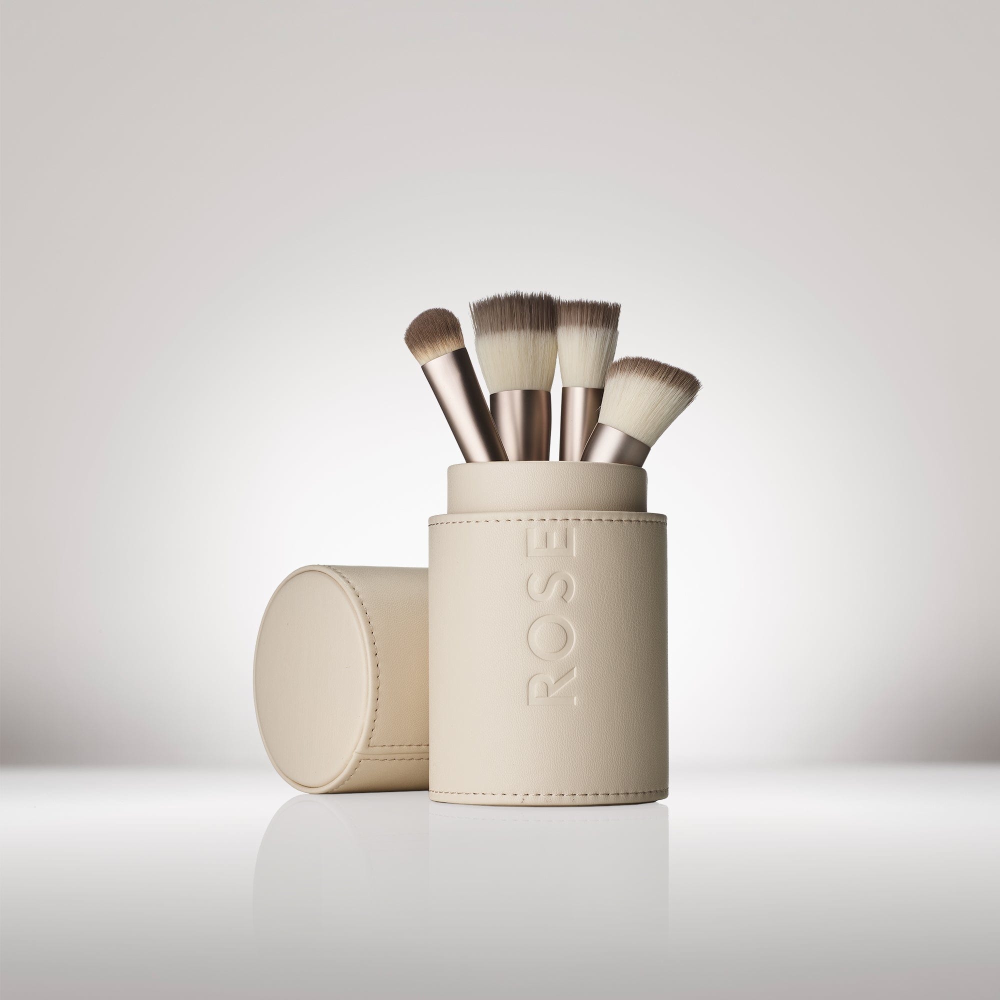 Signature Rose Inc Vegan Leather Brush Cup in a cylinder shape. Perfectly holds are your makeup brushes upright for optimal storage.