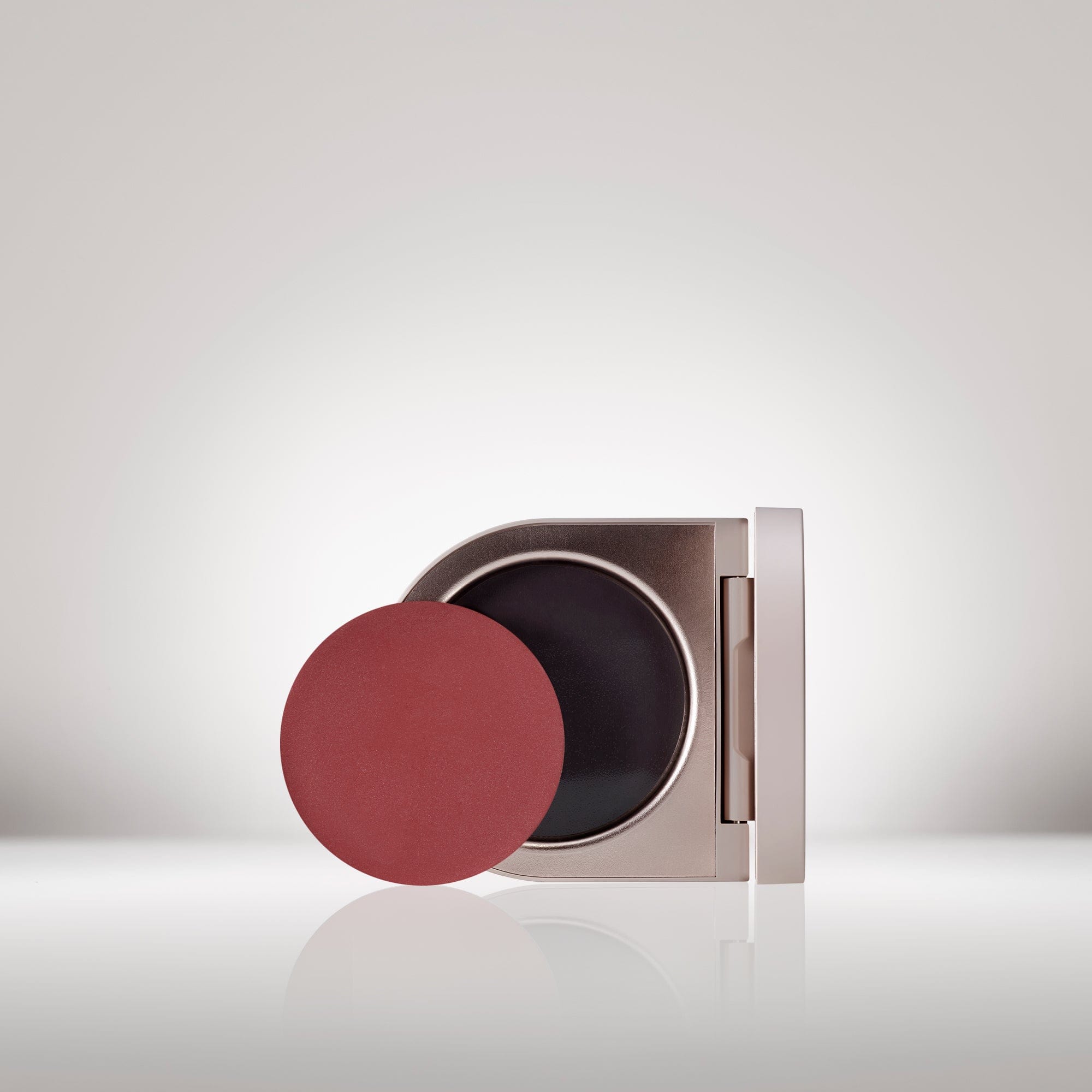 Image of the Cream Blush Refillable Cheek & Lip Color in Azalea in front of the open compact - Cream blush