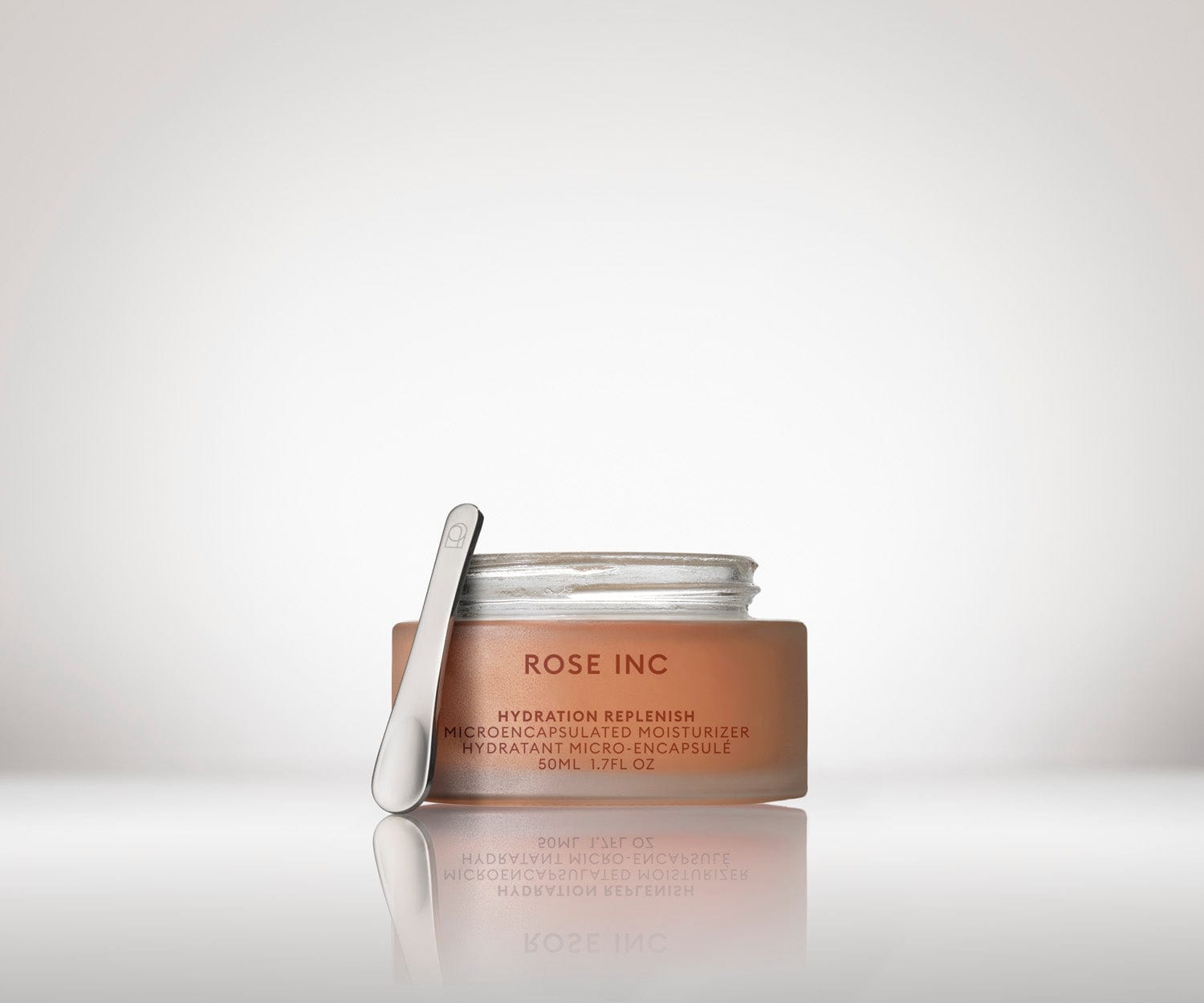Open Travel Size Hydration Replenish Moisturizer with Rose Inc Signature spoon