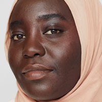 model KHASNAA wearing the shade 30W